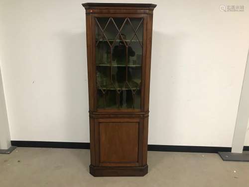 A 20th century mahogany corner display cabinet