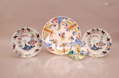 A pair of 19th century polychrome Delft plates, AF, together...