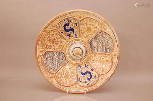 A copper glazed charger, 41cm diameter, cracked and repaired...