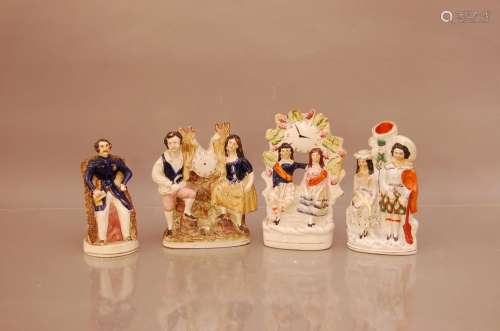 Four 19th century Staffordshire ceramic figures, including a...