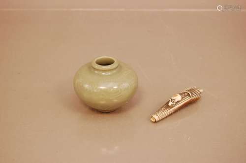 An early 20th century Chinese celadon porcelain small vase, ...