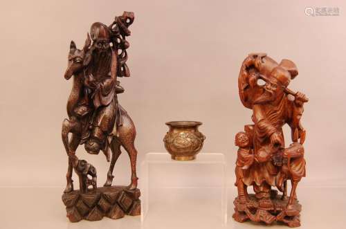 Two second half 20th century Chinese root carvings, the tall...