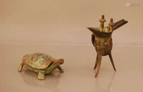 Two Tang style cast bronze items, comprising an offering cup...