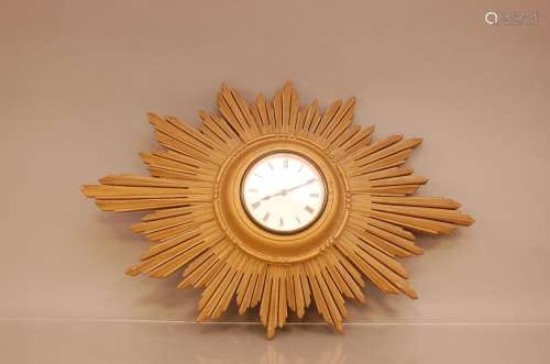 A 19th century French gilt wooden sunburst wall clock, with ...