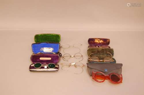 A collection of vintage spectacles, including a yellow metal...