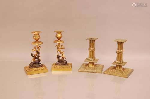 Two pairs of late 19th century brass candle sticks, one pair...