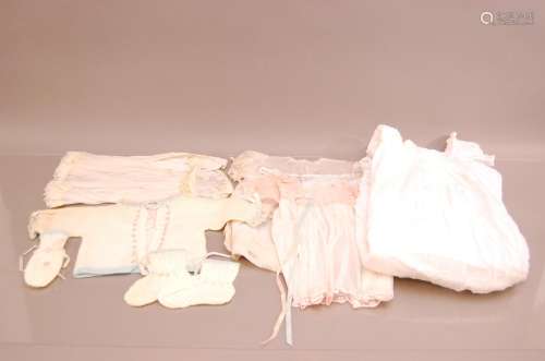 A collection of late 19th/early 20th century dolls clothing,...