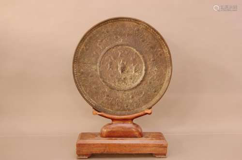 A 19th century Middle Eastern cast bronze mirror, 38cm diame...