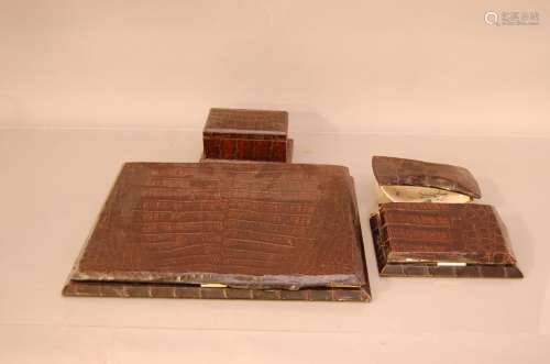 A group of c.1960s crocodile skin desk items, comprising a l...
