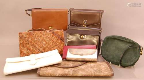 A collection of ladies handbags and clutches, including a ba...