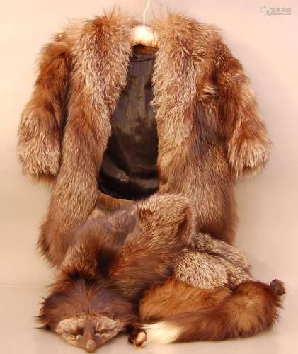 A collection of fur items, comprising a silver fox coat and ...