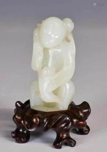 A White Jade Carved Monkey Ornament with Stand Qin