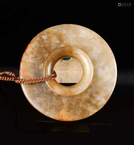 An Archaic Brown Jade Disc