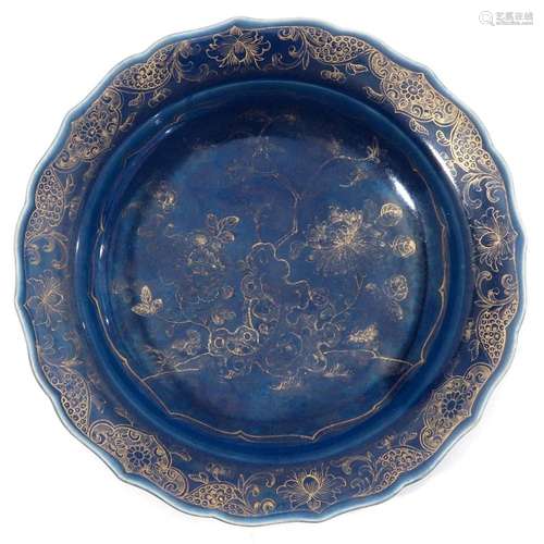 A BLUE AND GILT DECOR PLATE