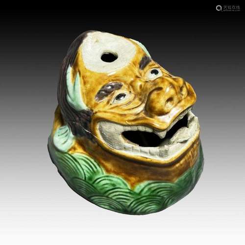 A CHINESE FAMILLE VERTE INCENSE BURNER IN THE SHAPE OF A MON...