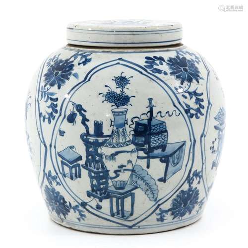 A BLUE AND WHITE JAR WITH COVER