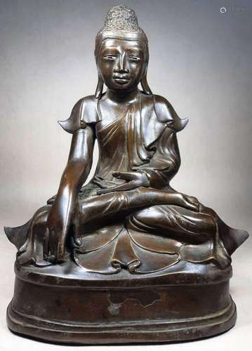 A BRONZE MIXED METAL BURMESE MANDALAY TYPE SEATED BUDDHA, 19...