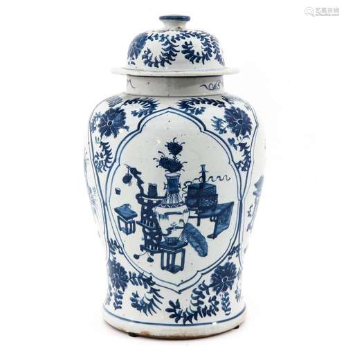 A BLUE AND WHITE JAR WITH COVER