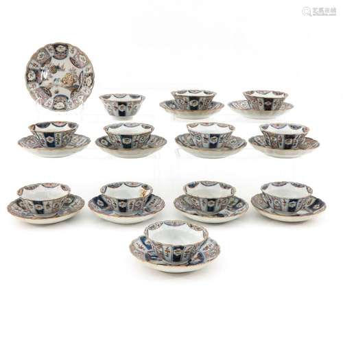 A SERIES OF 12 CUPS AND SAUCERS