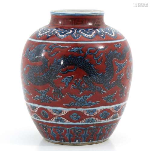 A RED AND BLUE DECOR JAR