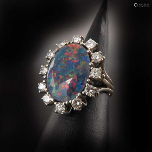 A Ladies 14KG Diamond and Opal Ring