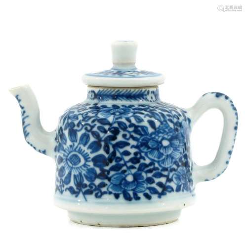 A BLUE AND WHITE MINIATURE TEAPOT