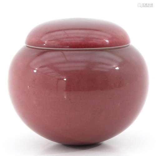 A PEACH BLOOM GLAZE JAR WITH COVER