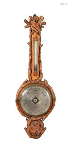 AN UNUSUAL VICTORIAN CARVED OAK MERCURY WHEEL BAROMETER