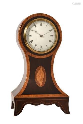 AN EDWARDIAN INLAID MAHOGANY BALLOON-SHAPED MANTEL TIMEPIECE