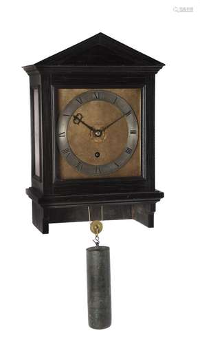 AN ARCHITECTURAL EBONY EIGHT-DAY VERGE HOODED WALL TIMEPIECE