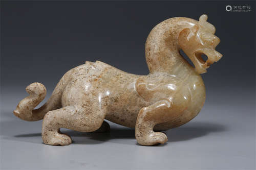 An Antique Jade Auspicious Beast Sculpture.