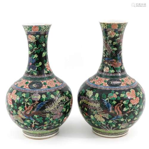 A Pair of Famille Noir Vases