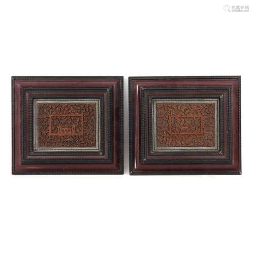 A Pair of Framed Carved Book Covers