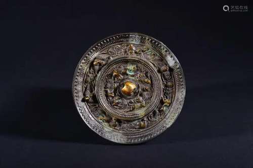 A GILT-BRONZE MIRROR .TANG PERIOD