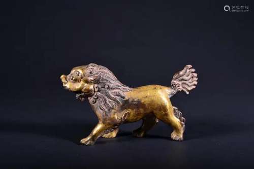 A GILT-BRONZE FIGURE OF LION.QING PERIOD