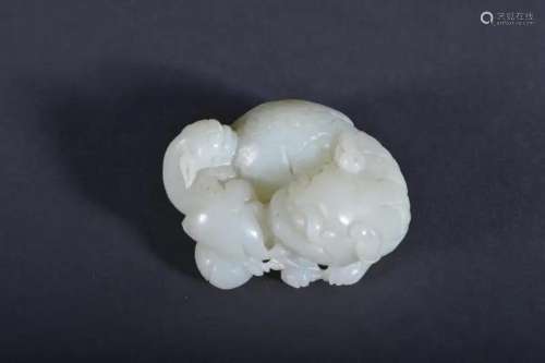 A CARVED WHITE JADE 'LION' GROUP.QING PERIOD