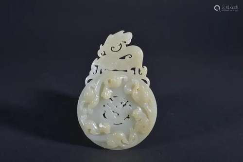 A CARVED WHITE JADE 'DRAGON' BI.QING PERIOD