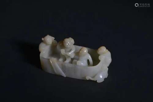 A CARVED WHITE JADE 'BOY' WASHER.QING PERIOD