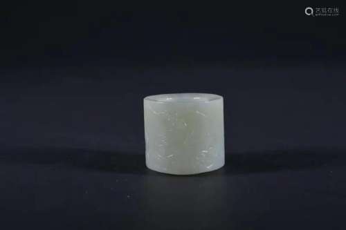 A CARVED WHITE JADE ARCHER'S RING
