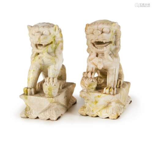 PAIR OF CARVED WHITE STONE FOO LIONS