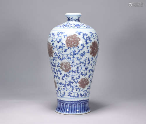 The red-wrapped plum bottle in the blue and white glaze of Y...