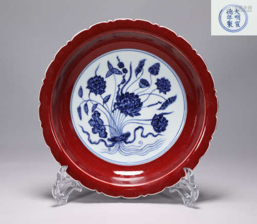 A lotus mouth plate with red glaze and blue and white flower...