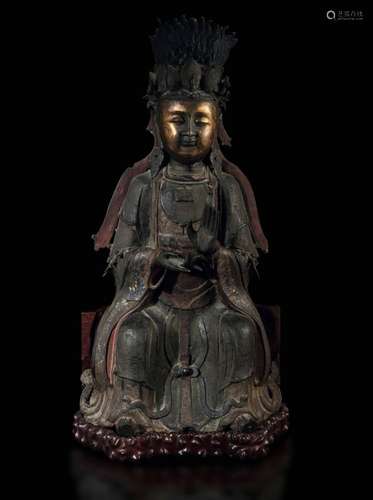 Crowned Guanyin in partially gilt bronze with traces of poly...