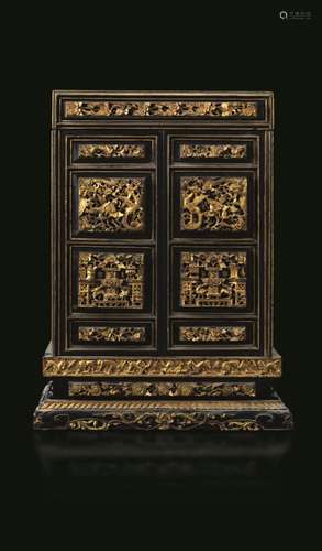 Qing Dynasty, 1800s A lacquered and gilt wood cabinet, China...