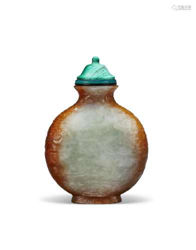 A RARE AND WELL-CARVED PALE GREY AND RUSSET JADEITE SNUFF BO...