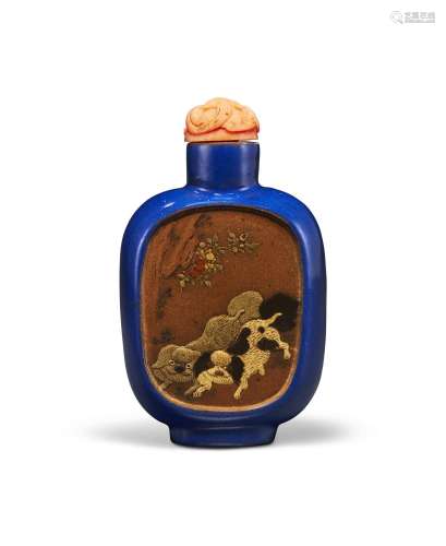 A SLIP DECORATED AND ENAMELED STONEWARE SNUFF BOTTLE