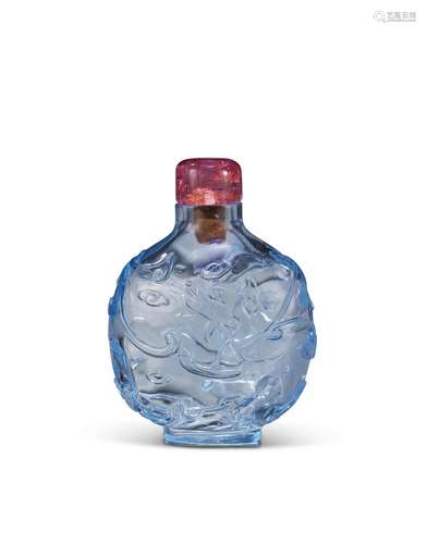 A CARVED TRANSPARENT PALE BLUE GLASS SNUFF BOTTLE