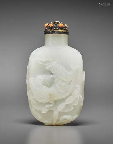 A CARVED WHITE JADE SNUFF BOTTLE