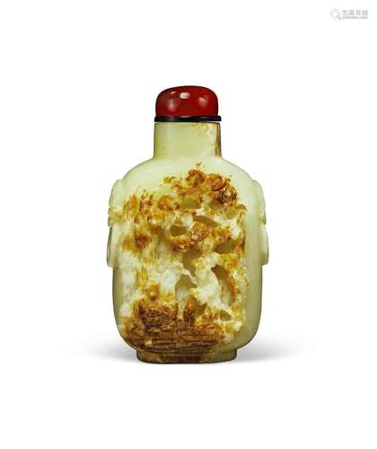 A CARVED YELLOW AND RUSSET JADE SNUFF BOTTLE