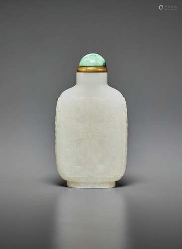 A CARVED WHITE JADE SNUFF BOTTLE